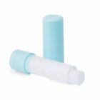 A light blue and white lip balm tube with the cap removed and placed beside it.