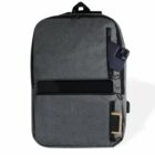 Gray backpack with external pockets, phone, and tablet partially visible.