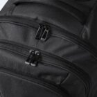Close-up of a black backpack with two zippered compartments.