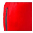 Close-up of a red fabric garment with a vertical black zipper.