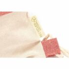 Close-up of a recycled cotton bag with red accents and a yellow tag.