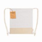A beige and white drawstring bag with a recycled cotton tag.