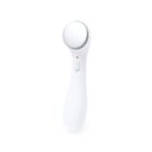 White handheld facial massager with a round metal head and an on/off switch.