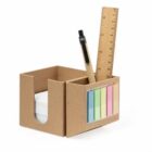 Desk organizer with sticky notes, pen, and ruler.