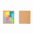 Wooden puzzle blocks in various colors beside a closed brown box.