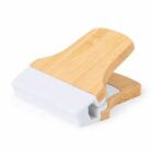 Wooden grip with a white rectangular rubber stamp surface underneath.