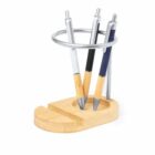 Wooden desk pen holder with three pens and a metal ring on top.