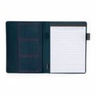 Open dark blue notebook with lined paper and card slots on the left side.