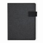 Dark gray fabric-covered book or notebook with a black strap closure, viewed from above.