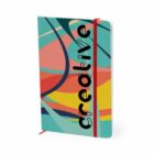 Colorful notebook with abstract design and the word creative on the cover.