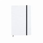 A white notebook with a black elastic band wrapped around it.