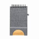 Gray spiral-bound notebook with a wooden accent at the bottom.