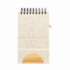 A small beige spiral notebook with a semi-circular wooden accent at the bottom.