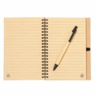 Open spiral notebook with lined pages and a pen placed diagonally on top.