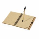 Open spiral notebook with lined pages and a pen placed diagonally.