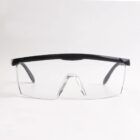 Safety glasses with clear lenses and black frames on a white background.