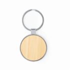 Round wooden keychain with a metal ring, isolated on a white background.