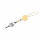 Key with wooden keychain and looped cord on a white background.
