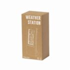 Simple cardboard packaging for a weather station device, showing its sketched design.