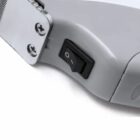 Close-up of a power switch on a grey electronic device.