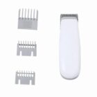 White electric hair trimmer with three different size comb attachments.