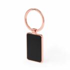 A rectangular black keychain with a copper-colored metal ring.