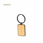 Keychain with a rectangular bamboo tag and a black circular ring.