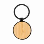 Round wooden keychain with black metal ring on a white background.