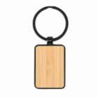 Rectangular wooden keychain with black ring on a white background.