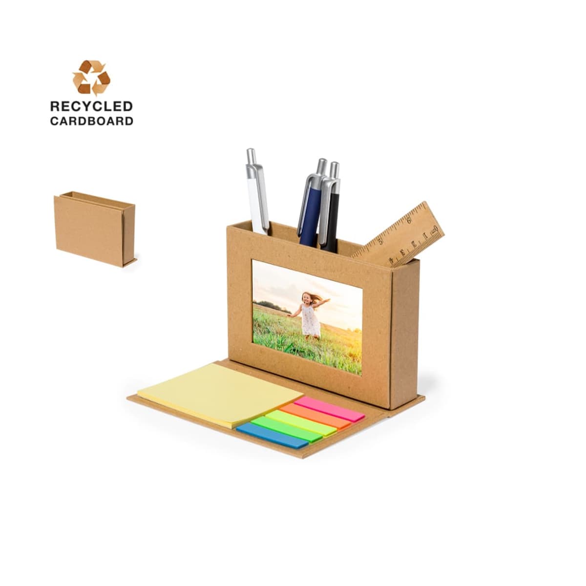 Desk organizer with a photo frame, notepads, pens, and ruler; made of recycled cardboard.