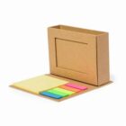 A set of colorful sticky notes in a cardboard holder.