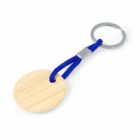 Round wooden keychain with blue cord and metal ring.