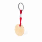 Round wooden keychain with a red cord and metal ring.
