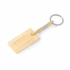 Wooden keychain with a rectangular tag and a metal keyring connected by a beige cord.