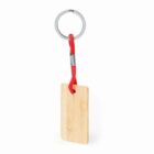 A wooden keychain with a red cord and metal ring.