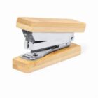 Wooden stapler with a metal mechanism on a white background.