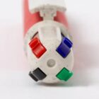 Top view of a multicolor pen with red, blue, green, and black ink options.