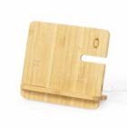 Bamboo wireless charging stand with a slot for a device.