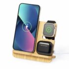 Wooden charging stand with phone, watch, and earbud case on it.
