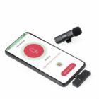 Smartphone with voice recording app open, clip-on microphone and adapter beside it.