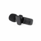 Small black lapel microphone with a foam windscreen and a clip attached.