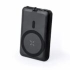 Small, black portable power bank with a circular design on the front.