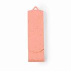 Pink cork yoga mat rolled up with a carrying strap against a white background.