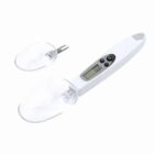 Digital measuring spoon with an LCD display and extra attachments.
