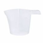Transparent plastic measuring cup with handle and spout.