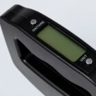 Digital luggage scale with LCD screen and buttons for on/tare and unit selection.
