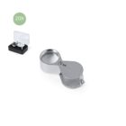 Silver 20X jewelers loupe with box on white background.