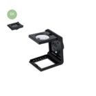 Folding magnifier showing 8x magnification, with a measuring scale at the base.