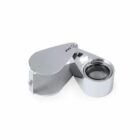 Silver magnifying jewelers loupe with a foldable cover, labeled 30X.