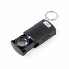 Black pocket magnifier with LED light and keychain attached.
